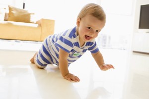 Baby crawling in living room